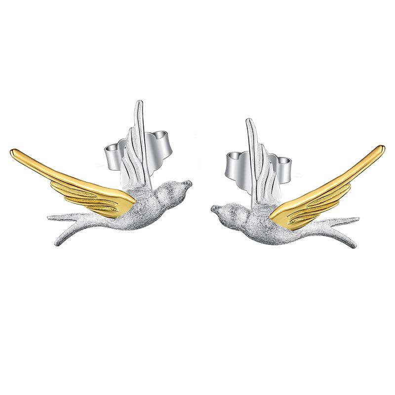 Orecchini di uccelli in volo